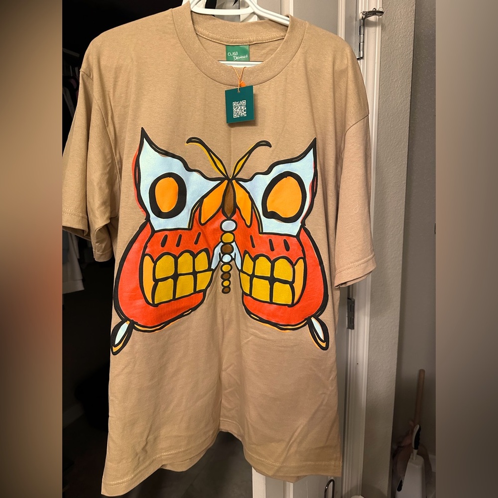 T Shirt , Brand new in bag. Bought by mistake and they don’t accept returns